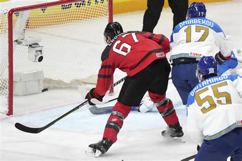 US beats Austria 4-1 for 4th straight win at ice hockey worlds, Canada eases past Kazakhstan 5-1